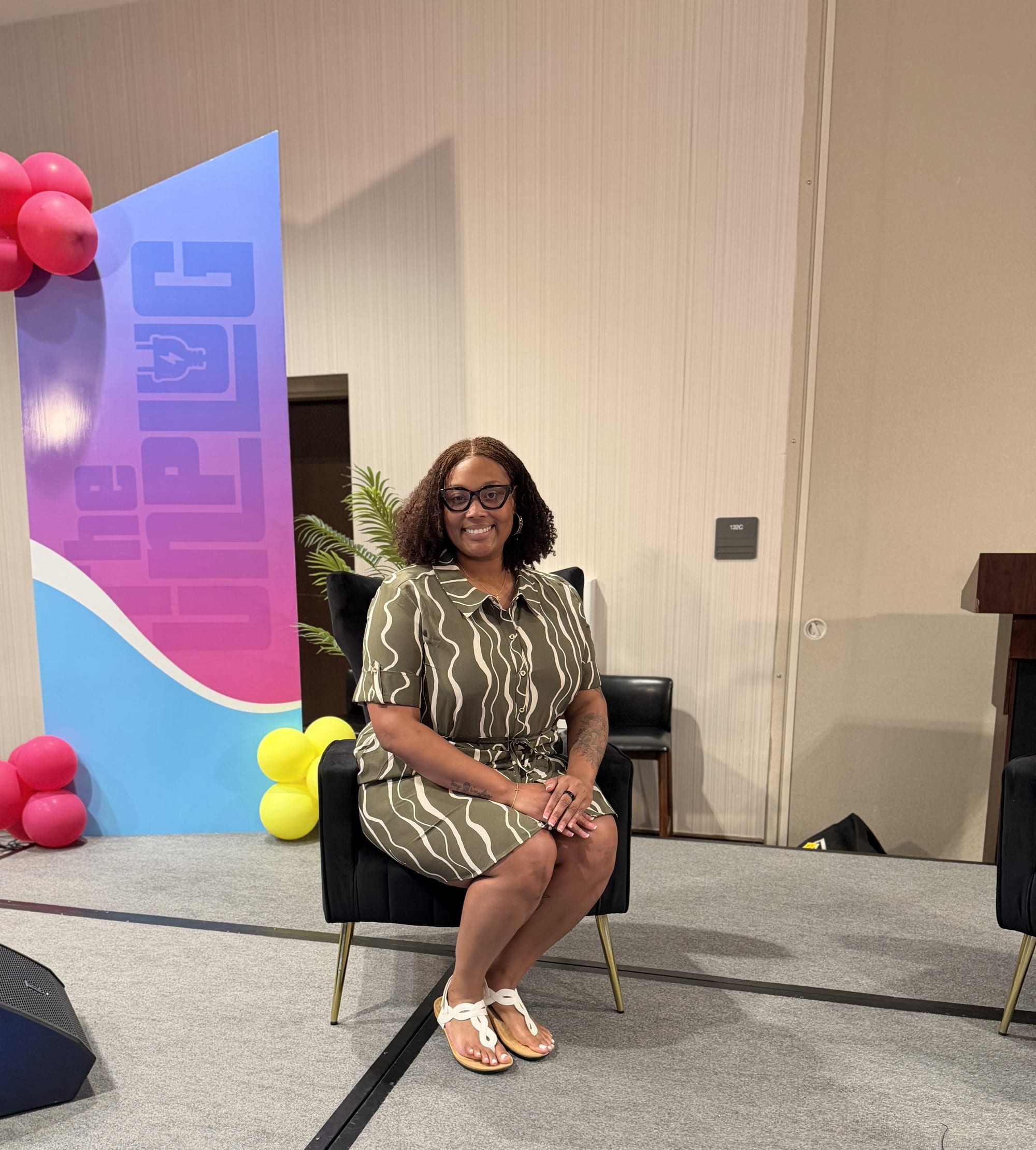 Creator Jalonni Weaver on stage at The Unplug event, speaking on personal branding