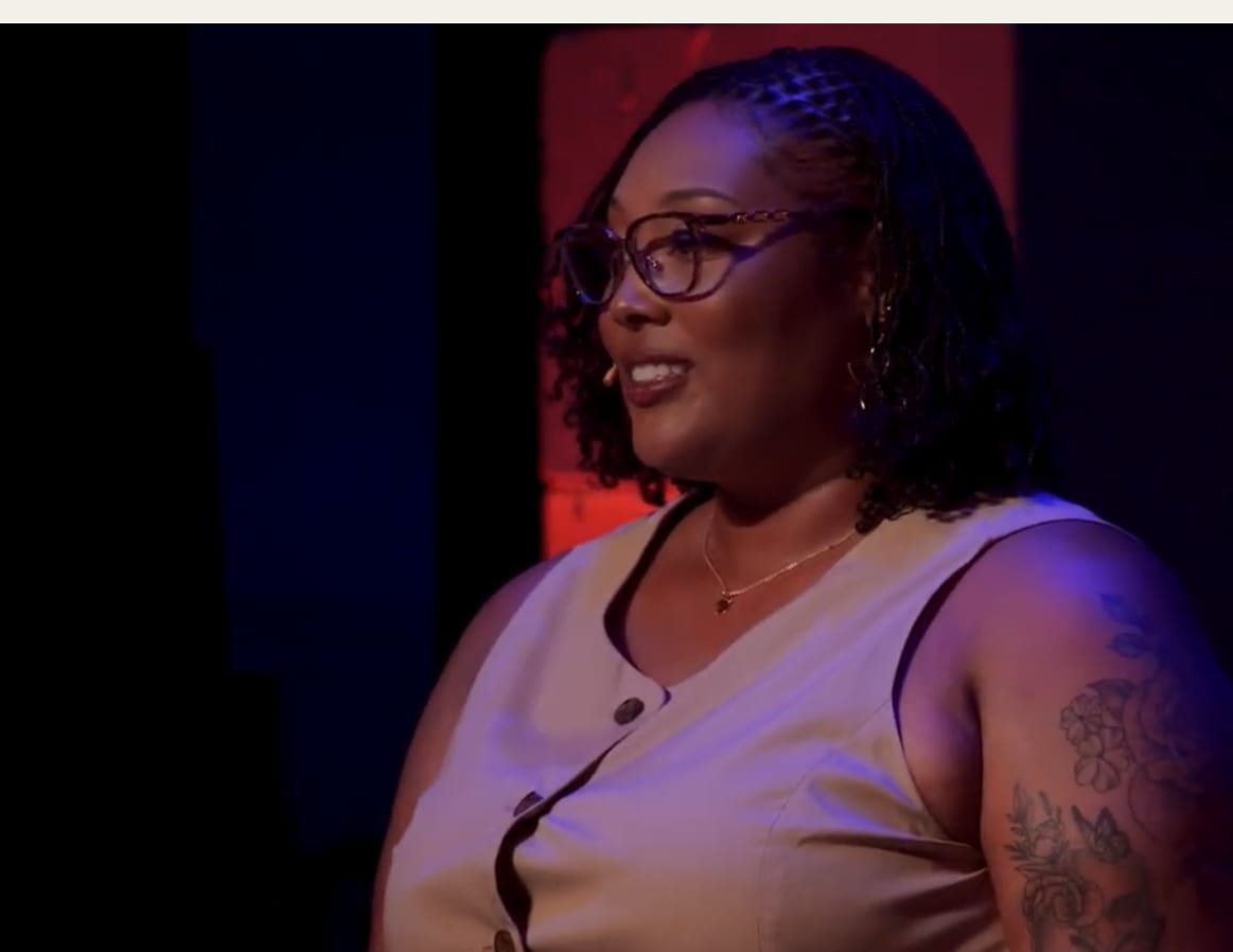 Jalonni Weaver, LinkedIn creator, mic’d on stage for a TEDx-style talk on personal branding