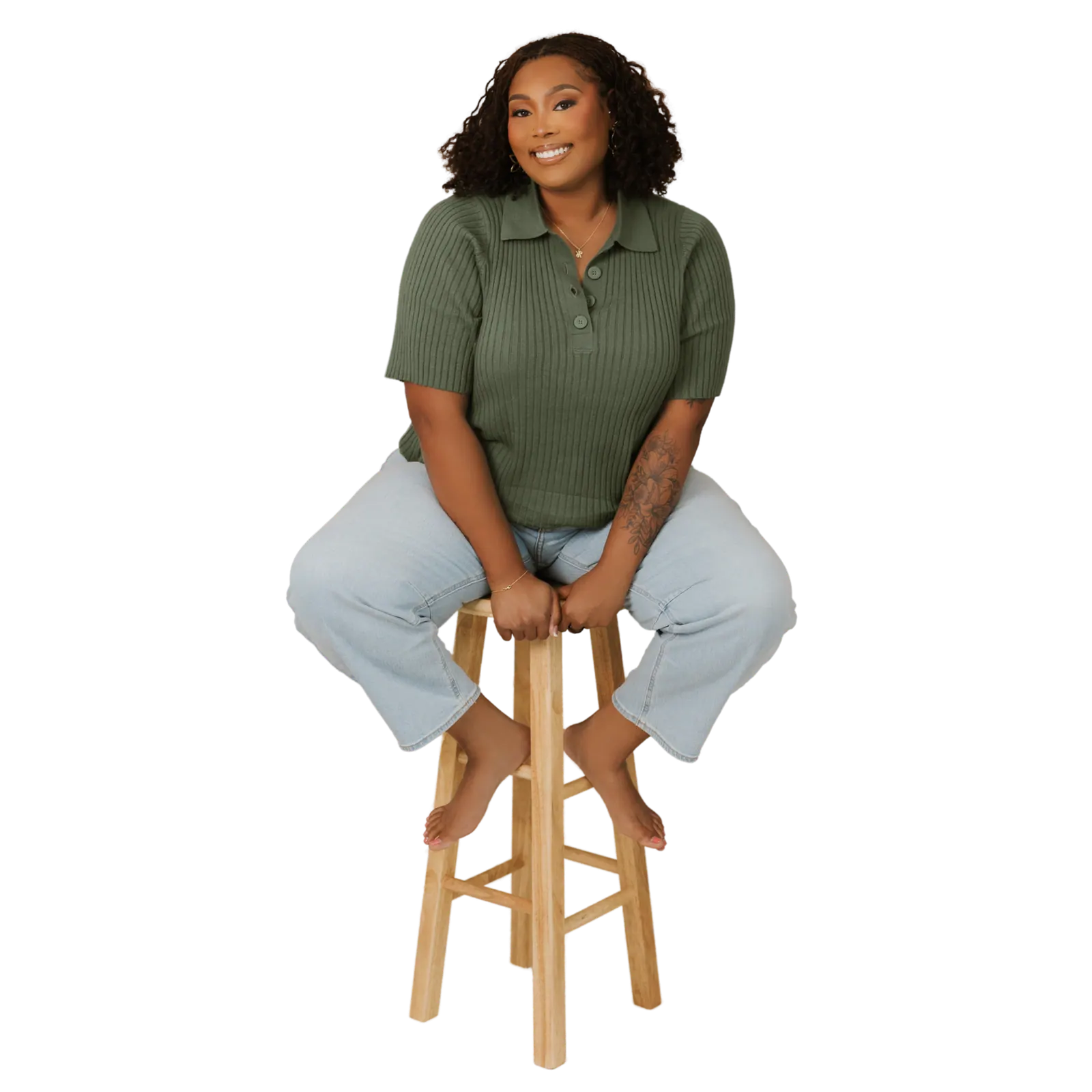 Jalonni Weaver, LinkedIn creator and personal branding educator, seated in a studio portrait