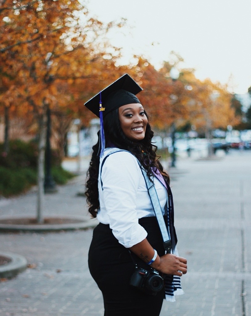 Jalonni Weaver in graduation cap and gown, camera in hand | early career and personal branding roots