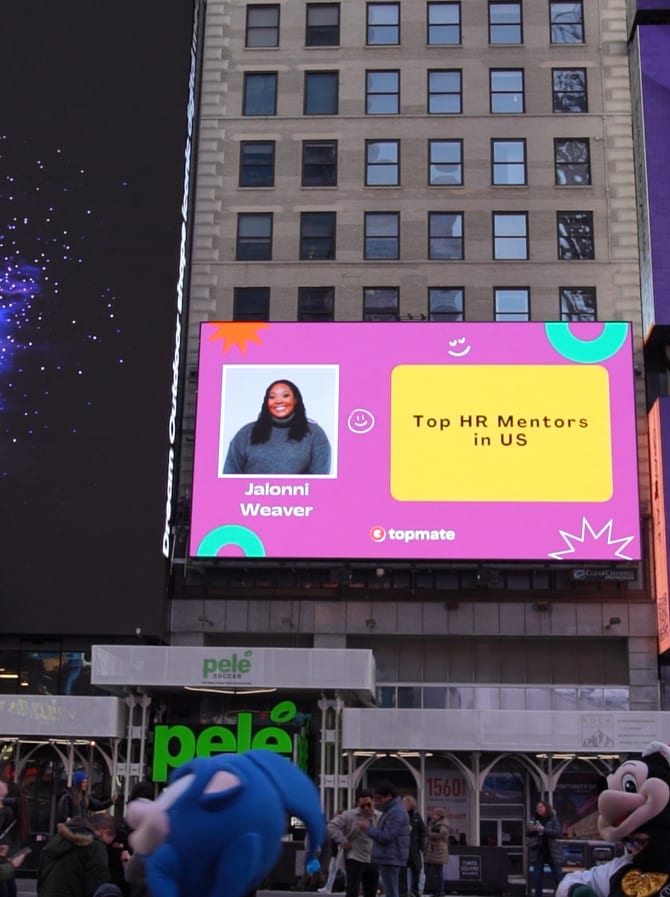 Times Square billboard featuring LinkedIn creator Jalonni Weaver as a Top HR Mentor